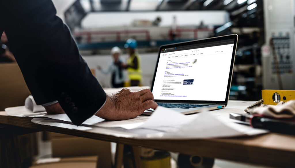 Man searching roll-to-roll on google in manufacturing set