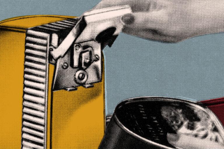close up of a hand using a can opener